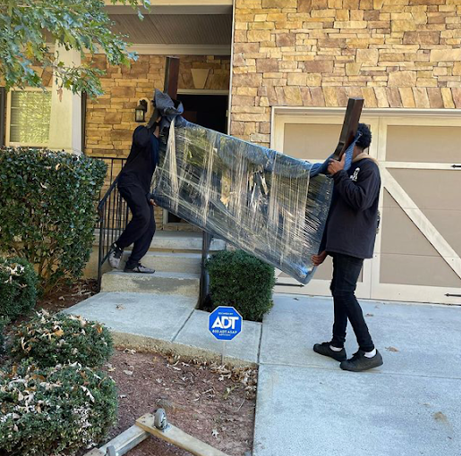 Professional movers loading a rental truck carefully